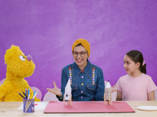 Jad, Salma, and a young girl make a spaceship